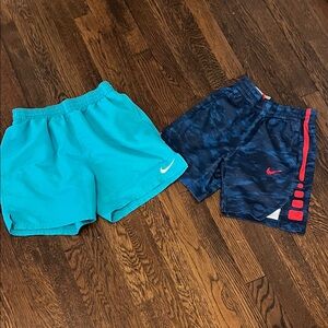 2 pair Nike shorts can be  swim trunks both have side pockets  size 8 to 12